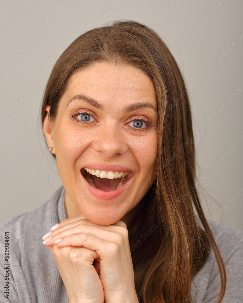 Smiling woman face portrait. Happy girl leaning on her hands with long hair isolated portrait Smiling woman face portrait. Happy girl leaning on her hands with long hair isolated portrait