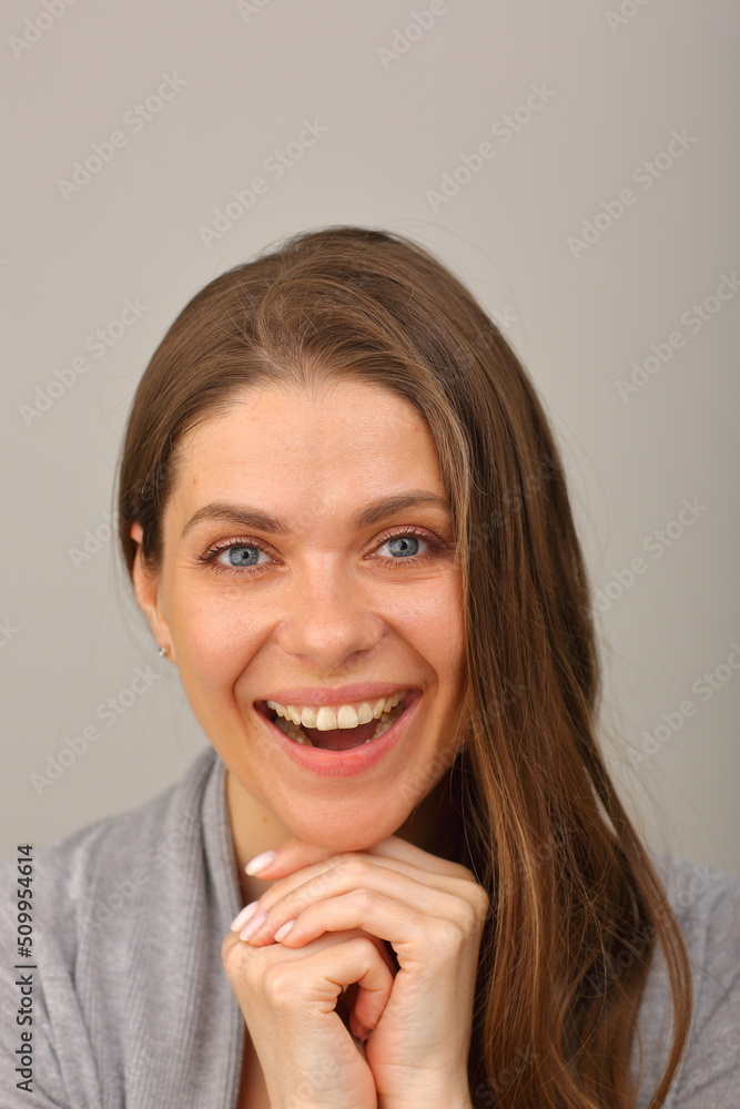 Close up woman face portrait. Isolated head shot of smiling woman leaned on hands. Close up woman face portrait. Isolated head shot of smiling woman leaned on hands.