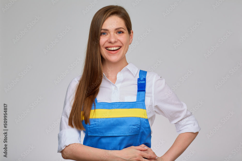 Smiling woman worker plumber or electrician wearing blue overalls. Smiling woman worker plumber or electrician wearing blue overalls.