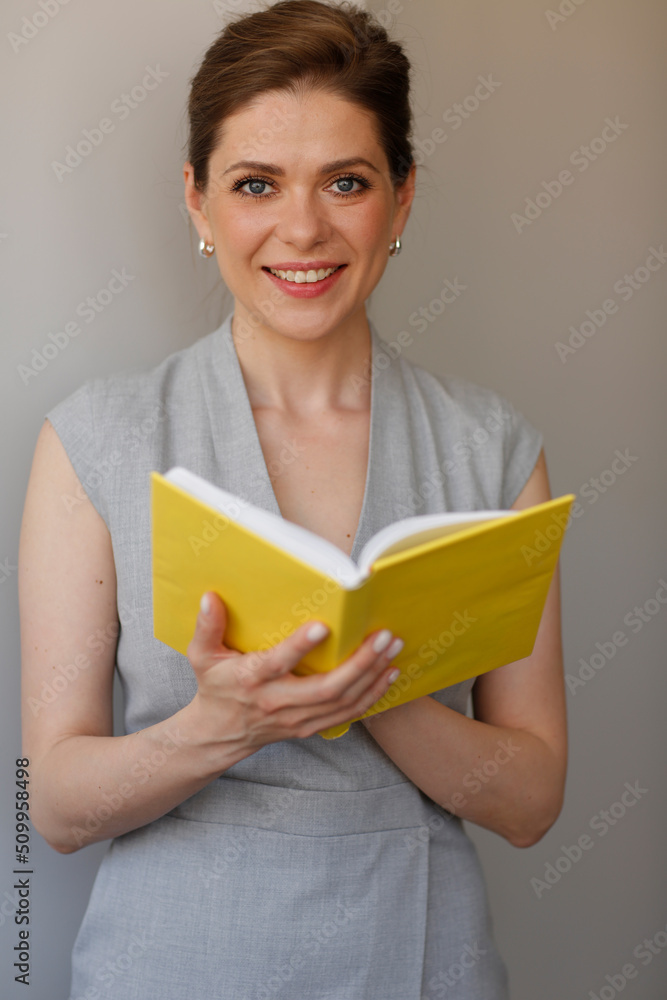 Teacher woman holding open book, or student girl with work book. Teacher woman holding open book, or student girl with work book.