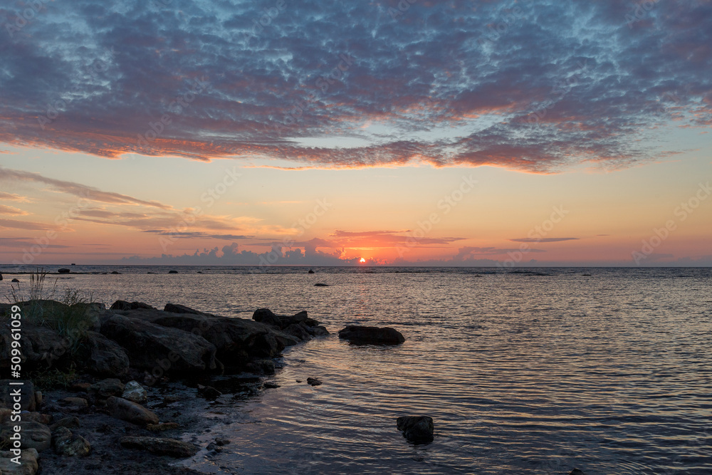 Obraz premium Sunset over the Baltic sea. Rocky coast in Estonia.