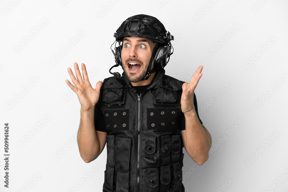 Young caucasian swat isolated on white background with surprise facial expression Young caucasian swat isolated on white background with surprise facial expression