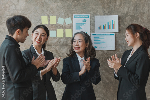 A highly qualified senior businesswoman and her staff cheered in meetings  planning meetings and training sessions to discuss internal issues. Management concepts of senior executives.