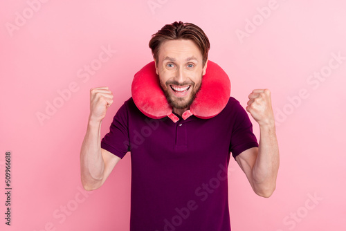 Photo of young excited man fists hands ecstatic lottery trip journey isolated over pink color background