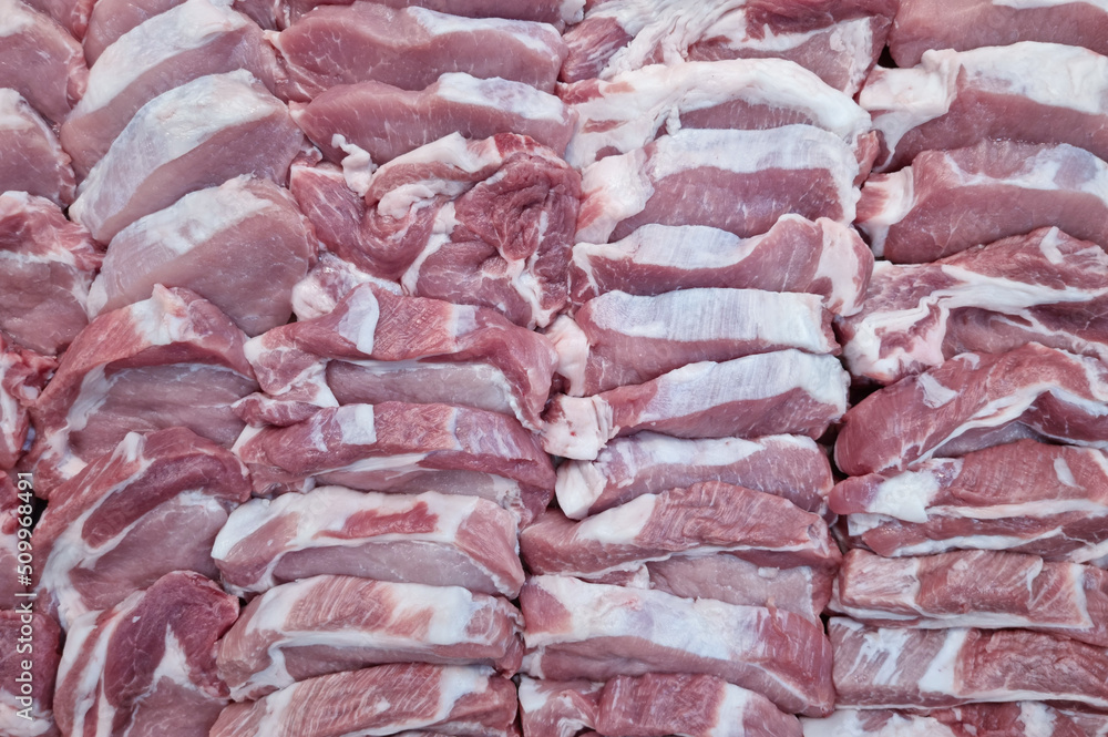 many pieces of fresh red pork meat food background