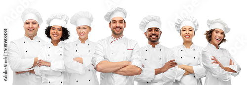 Fotografija cooking, culinary and profession concept - international team of smiling chefs w