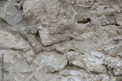old wall made of light stone. background texture