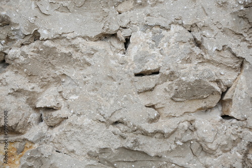 old wall made of light stone. background texture