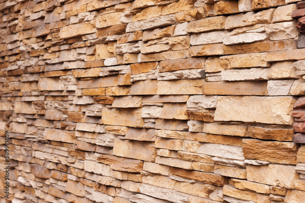 This is a horizontal modern brick wall for pattern and background. Angle view. Selective focus. This is a horizontal modern brick wall for pattern and background. Angle view. Selective focus.
