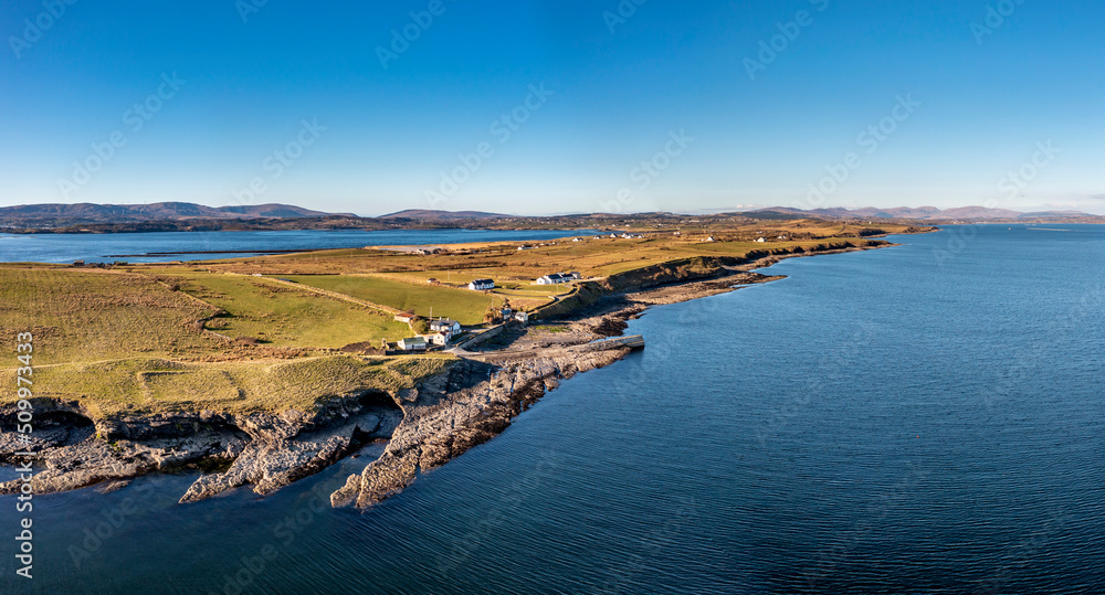 Aerial view of the rocky coast in front of the Ballysaggart Ringfort at St Johns Point in County Donegal - Ireland.