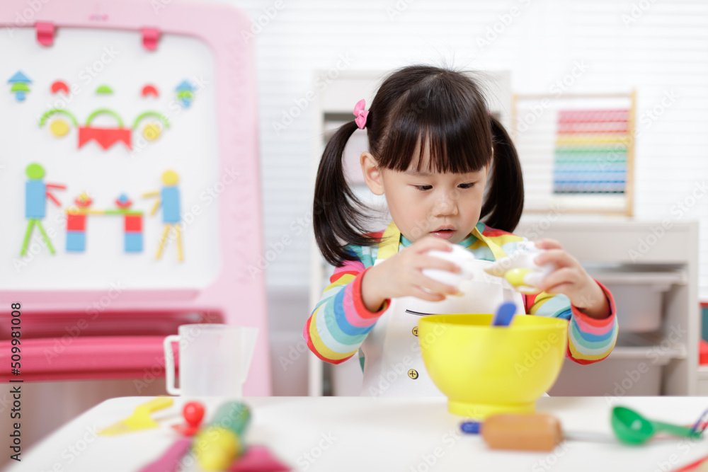 young girl pretend playing food preparing at home young girl pretend playing food preparing at home