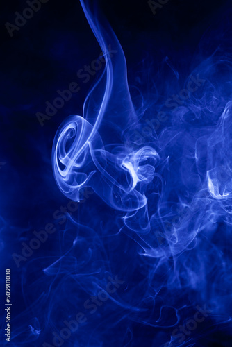 Blue smoke on a black background.