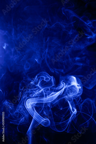 Blue smoke on a black background.