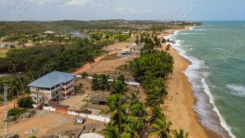 Aerial view of buildings along the coastline near the beach, Lamina, Ghana. photo