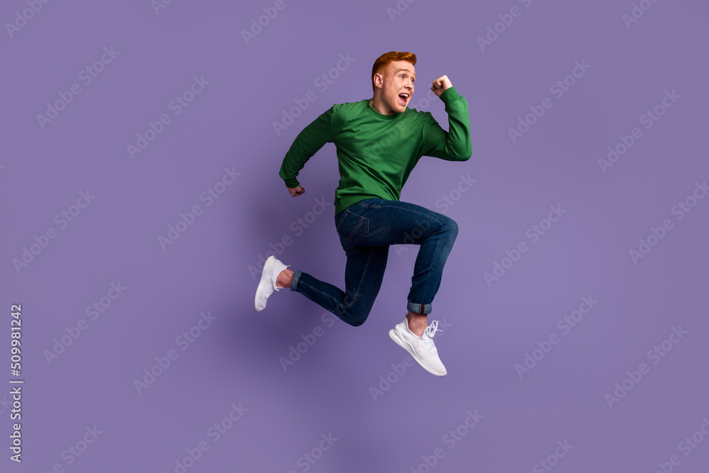 Full size profile side photo of young man runner jumper rush fast discount isolated over violet color background