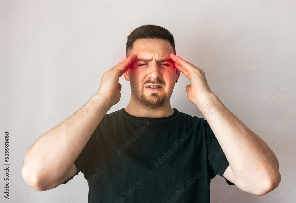 Young man with headache Young man with headache