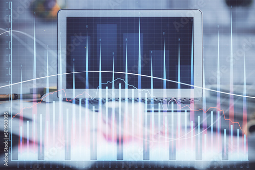 Forex market chart hologram and personal computer background. Multi exposure. Concept of investment. © peshkova