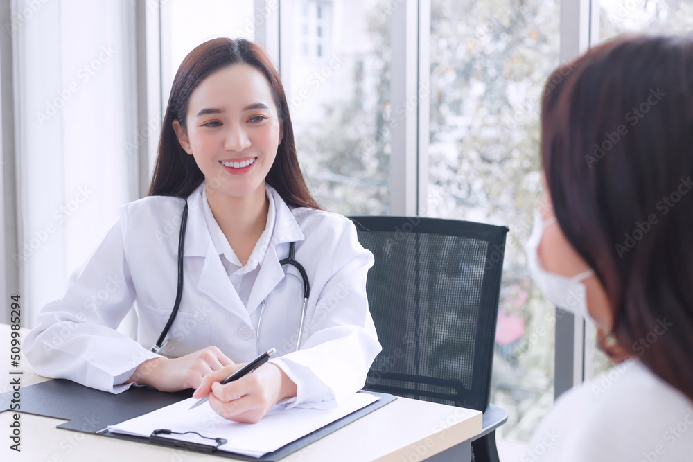Asian professional woman doctor suggests healthcare solution to her patient elderly in examination room at hospital. Asian professional woman doctor suggests healthcare solution to her patient elderly in examination room at hospital.