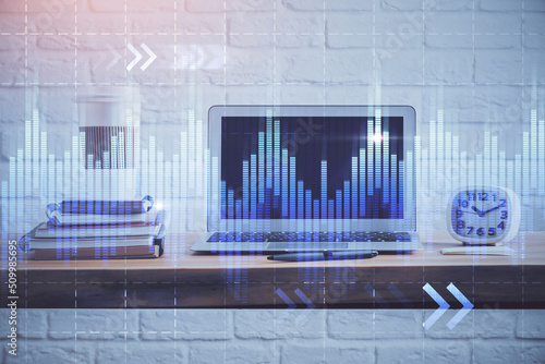 Forex market chart hologram and personal computer background. Multi exposure. Concept of investment.