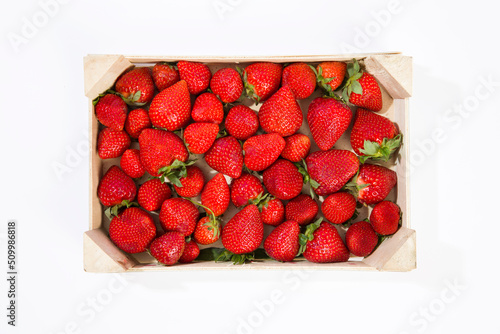 crate of strawberries on a white background
