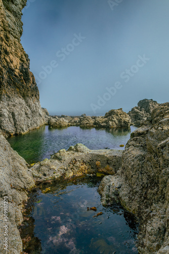 The Peninsula of Howth Head on a foggy day, the cliffs warped by fog, Dublin, Seashore of cliffs, bays and rocks landscape, dangerouse cliffs, spectacular views in Ireland , Ireland