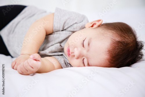 newborn sleeping baby in bed. Modern motherhood, banner size