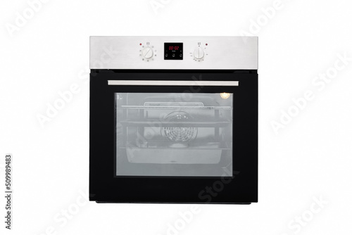 Electric oven black, with aluminum panel and electronic display. Front view. Isolated on white