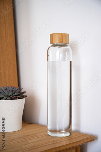 Glass water bottle with wooden lid, drinking water and healthy lifestyl concept