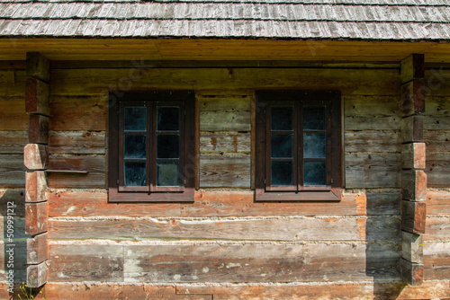 A wooden house, an old historic structure. A beautiful, intimate, wooden house in the Carpathians, Poland. Historic wooden building. A house that smells like a forest