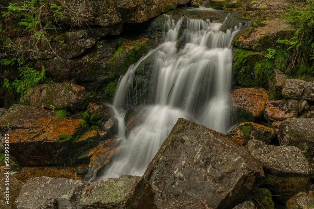 Waterfall of Jedlova creek in Jizerske mountains in spring morning Waterfall of Jedlova creek in Jizerske mountains in spring morning