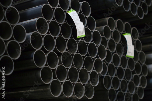 high quality steel pipe or Aluminum and chrome stainless pipes in stack waiting for shipment in warehouse