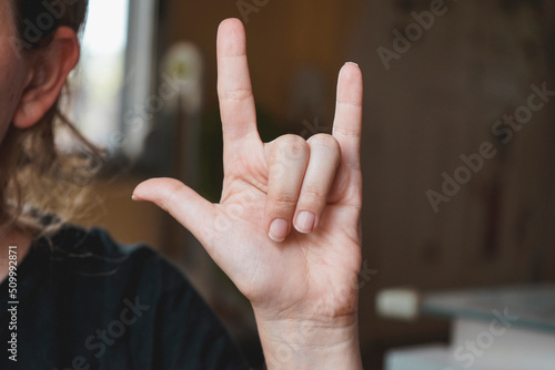 Wallpaper Mural Female hand doing the word love in sign language Torontodigital.ca