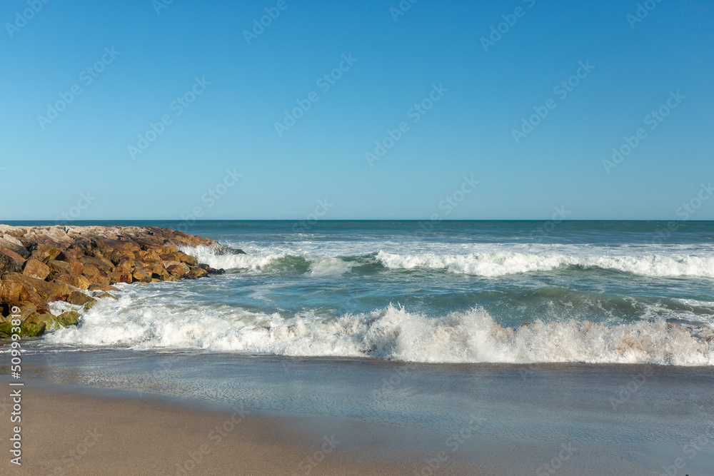 photo of rock breakwater at mar del plata beach, Argentina