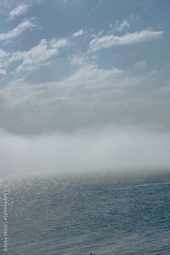 Fototapeta premium The Peninsula of Howth Head on a foggy day, the cliffs warped by fog, Dublin, Seashore of cliffs, bays and rocks landscape, dangerouse cliffs, spectacular views in Ireland , Ireland