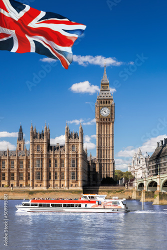 Famous Big Ben with bridge over Thames and tour boat on the river in London  England  UK