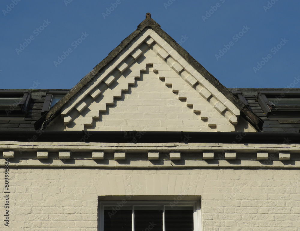 Detail of gable with brick decoration in a house. Historic city of Winchester. England. United Kingdom.