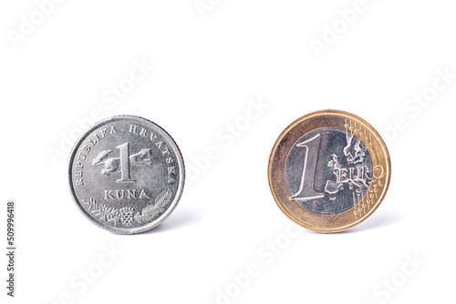 One croatian kuna coin and one Euro coin detailed studio shot. photo