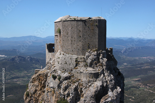 Ruins of the medieval Quéribus castle on top of a rocky mountain summit near Cucugnan village, Occitanie region in France photo