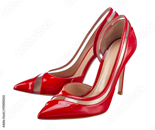 Classic red shoes made of glossy genuine leather with high elegant heels, with a transparent insert, isolated on a white background.