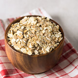 Wooden Bowl of Cereal Oat Flakes Healthy Food Linen Napkin Square Gray Background