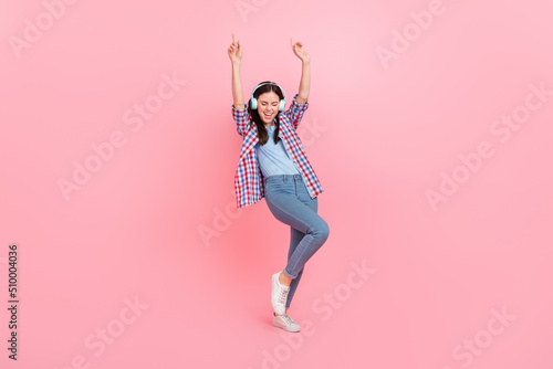 Full body photo of ecstatic delighted cheerful female have fun in nightclub party dance isolated on pink color background