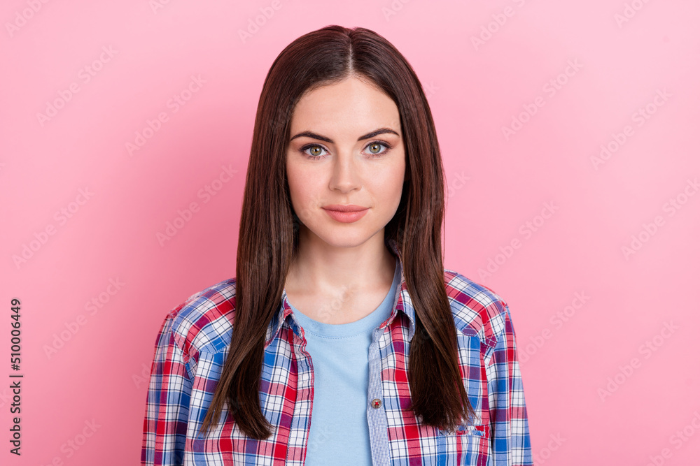 Portrait of charming good looking female with long silky hair relaxing on weekend day isolated on pink color background Portrait of charming good looking female with long silky hair relaxing on weekend day isolated on pink color background
