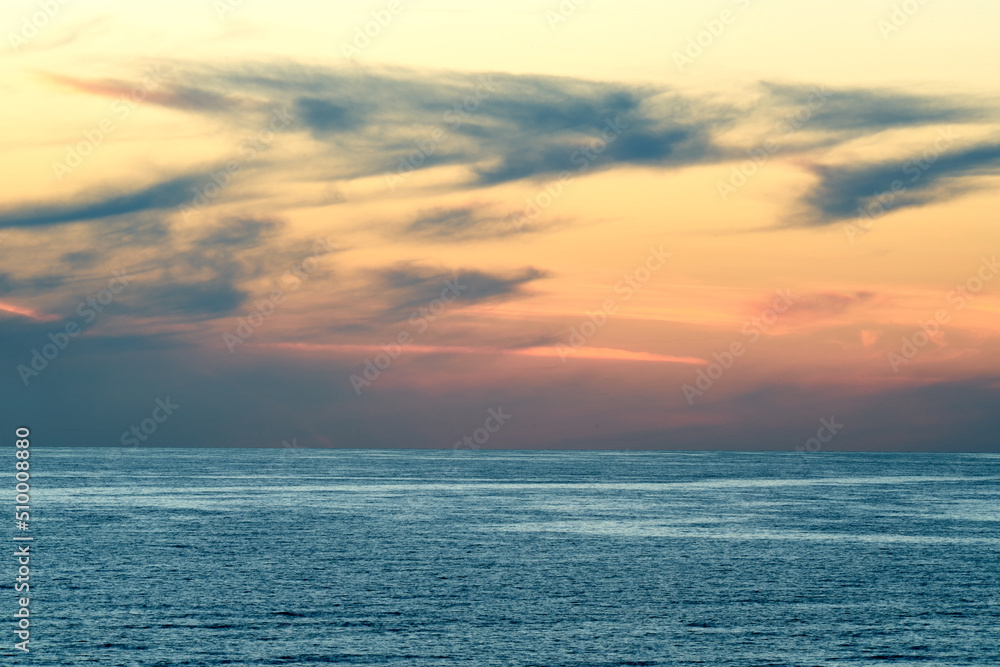 Sunset over the calm ocean