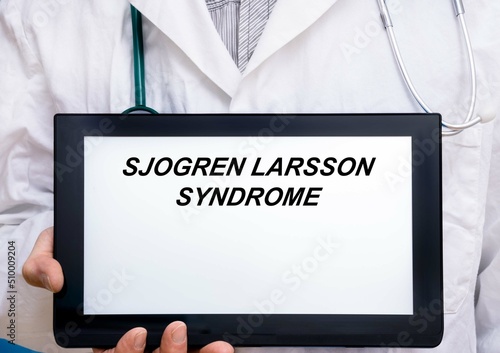 Sjogren Larsson Syndrome.  Doctor with rare or orphan disease text on tablet screen Sjogren Larsson Syndrome photo