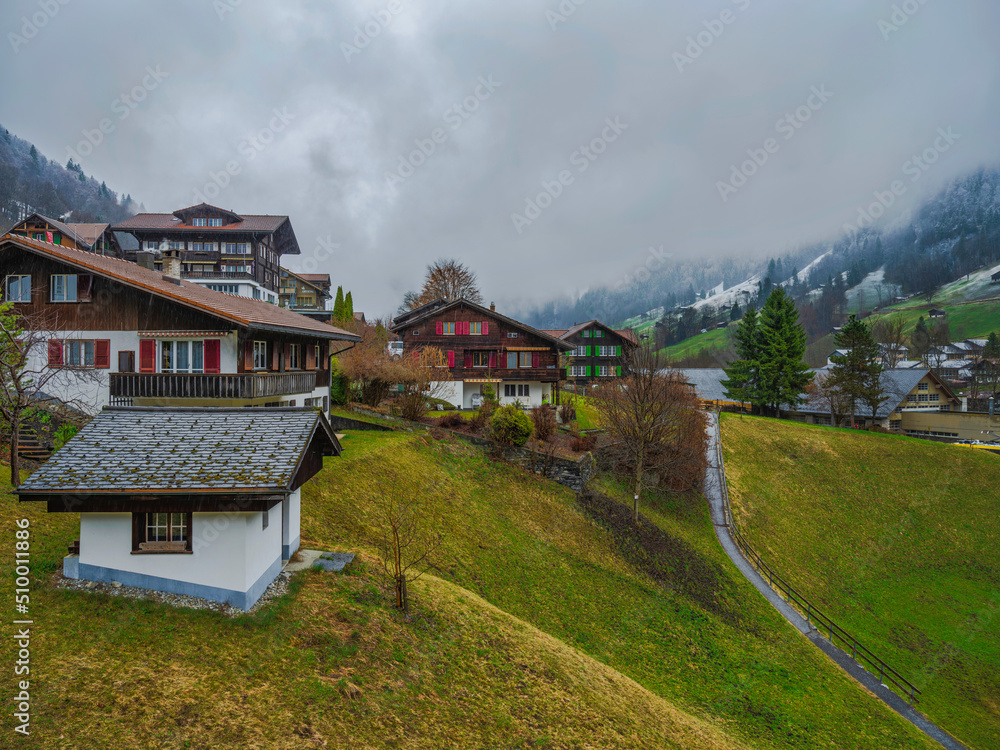 Swiss traditional houses on the hill in  Lauterbrunnen, Switzerland