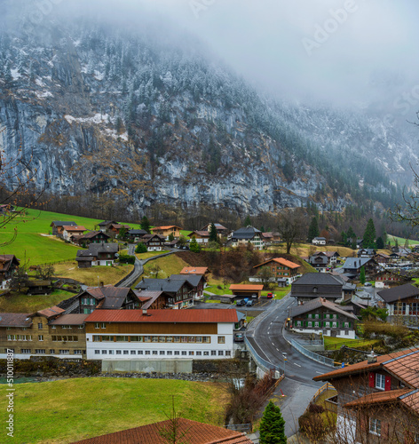 Lauterbrunnen village houses on the foothill of the mountain in Switzerland