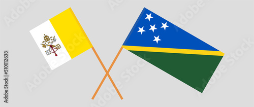 Crossed flags of Vatican and Solomon Islands. Official colors. Correct proportion