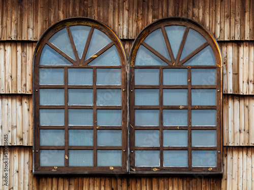 A wooden window in the church, an antique window, an old window frame and old panes. A beautiful, intimate facility, all built of wood. It was established many years ago.