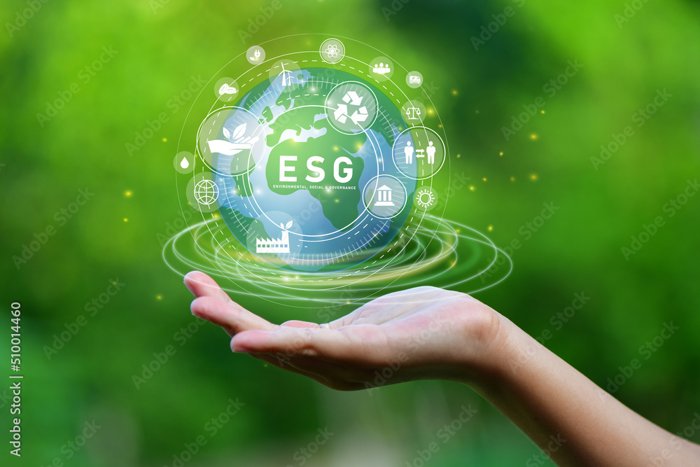 ESG icon concept, Hand of man holding ESG icons for Environment Social and Governance on network connection. ESG icon concept, Hand of man holding ESG icons for Environment Social and Governance on network connection.