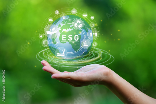 ESG icon concept, Hand of man holding ESG icons for Environment Social and Governance on network connection. 